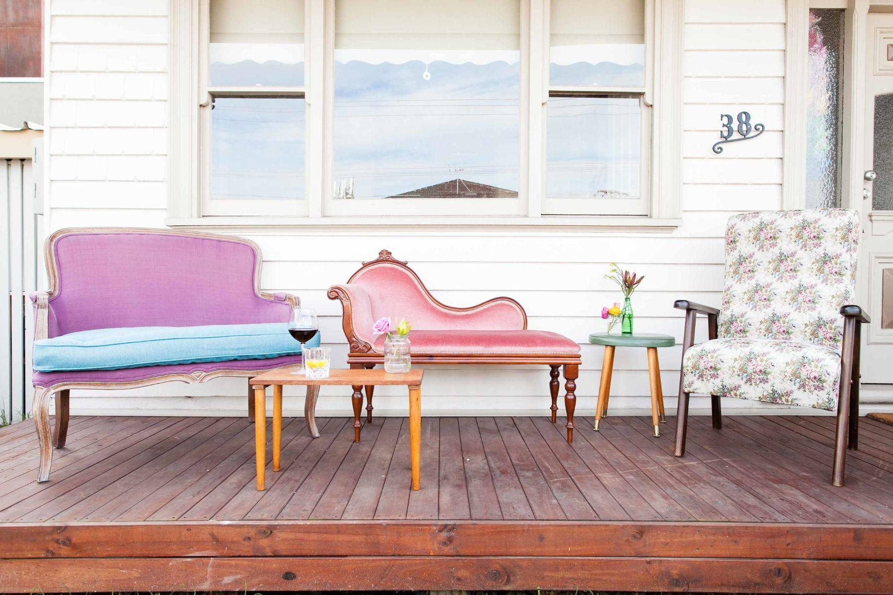 Purple and blue love seat, pink settee and floral lounge chair