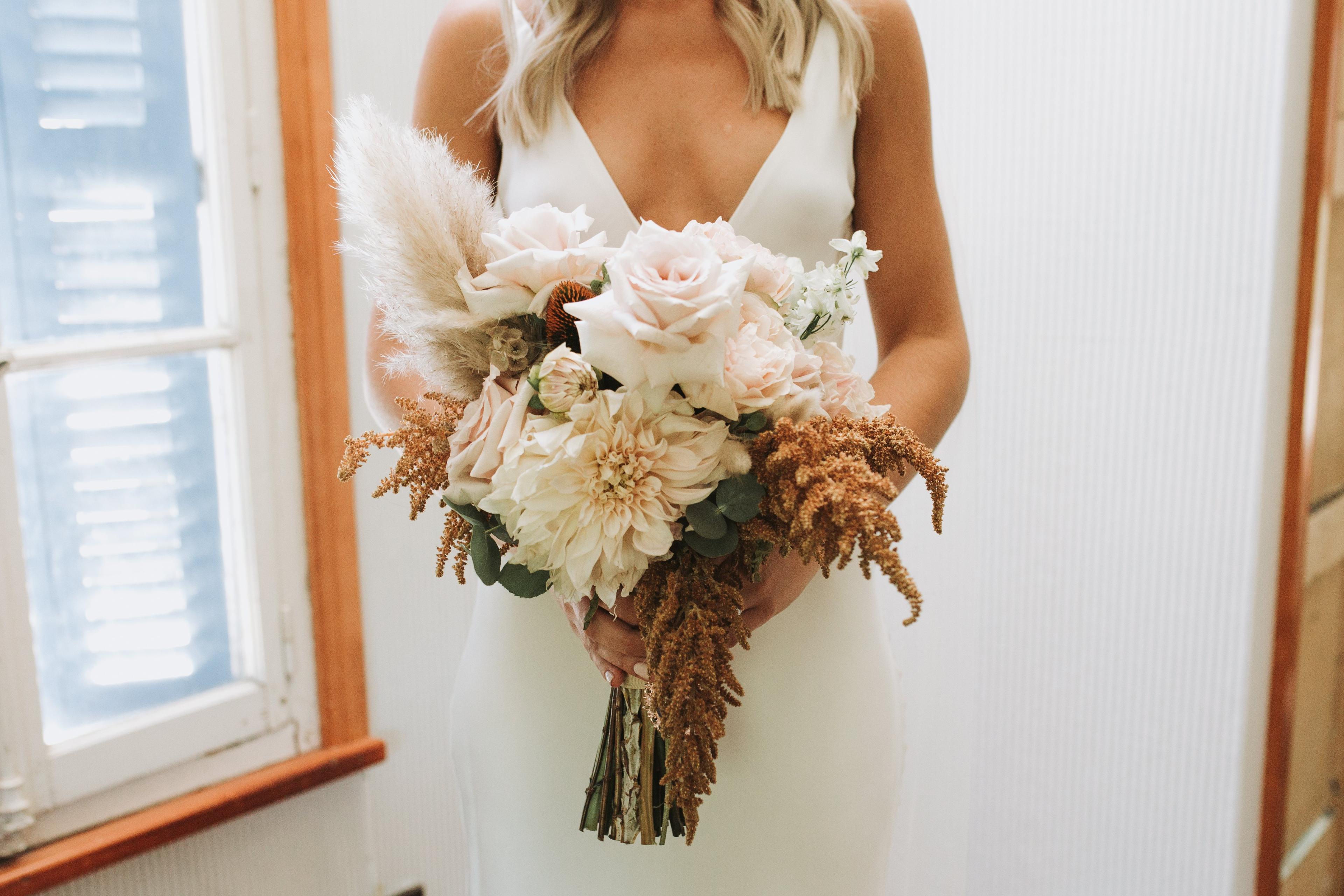 Bridal bouquet and wedding dress