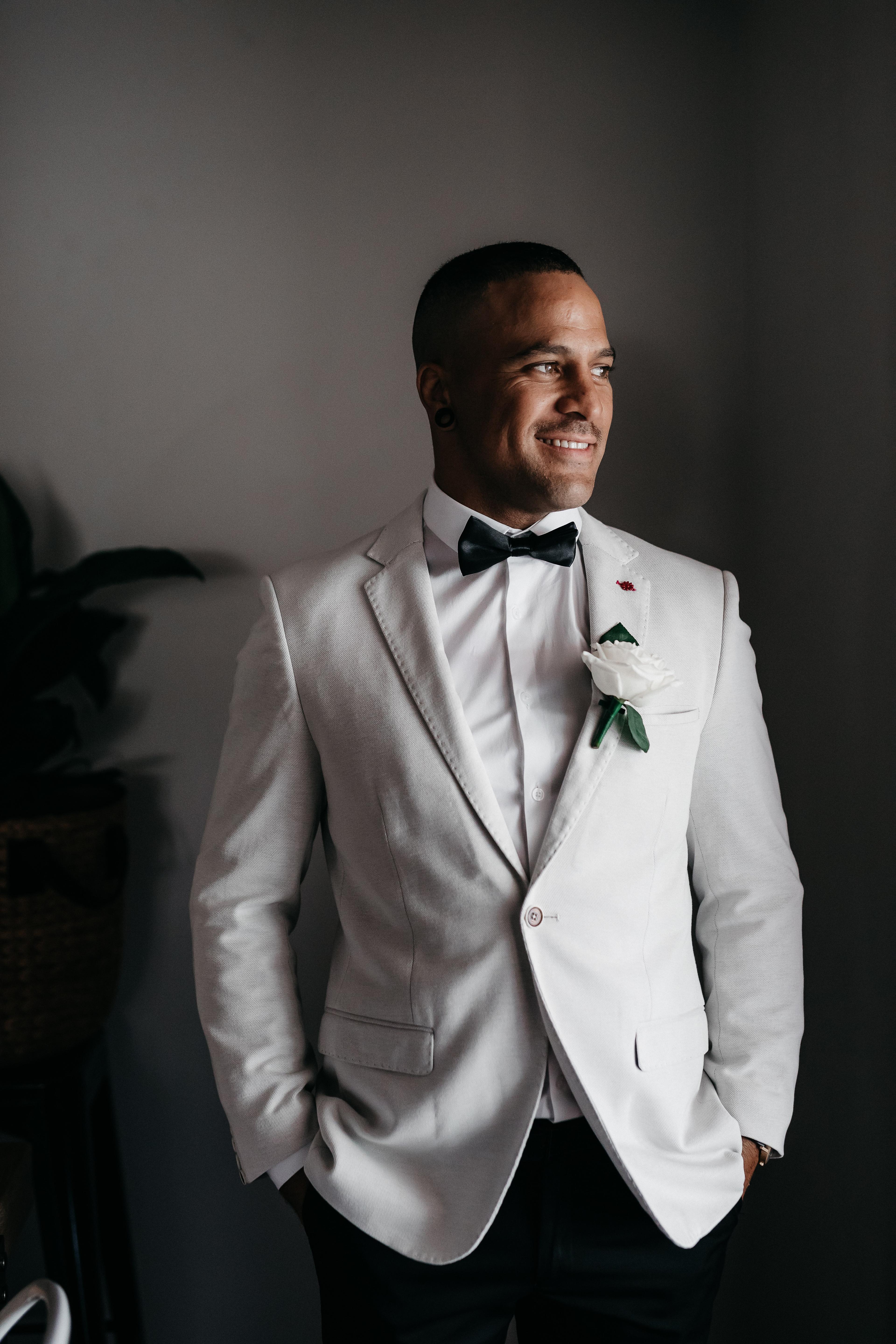 Groom in a white suit at his wedding shot in Perth