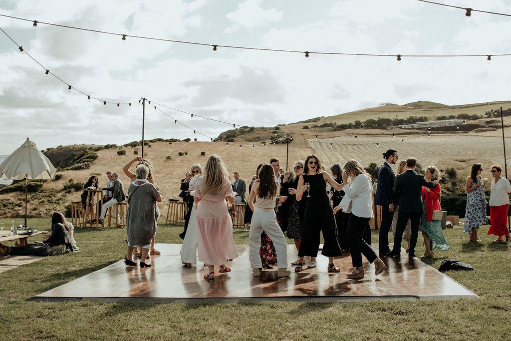 wedding party dancing on outdoor dancefloor
