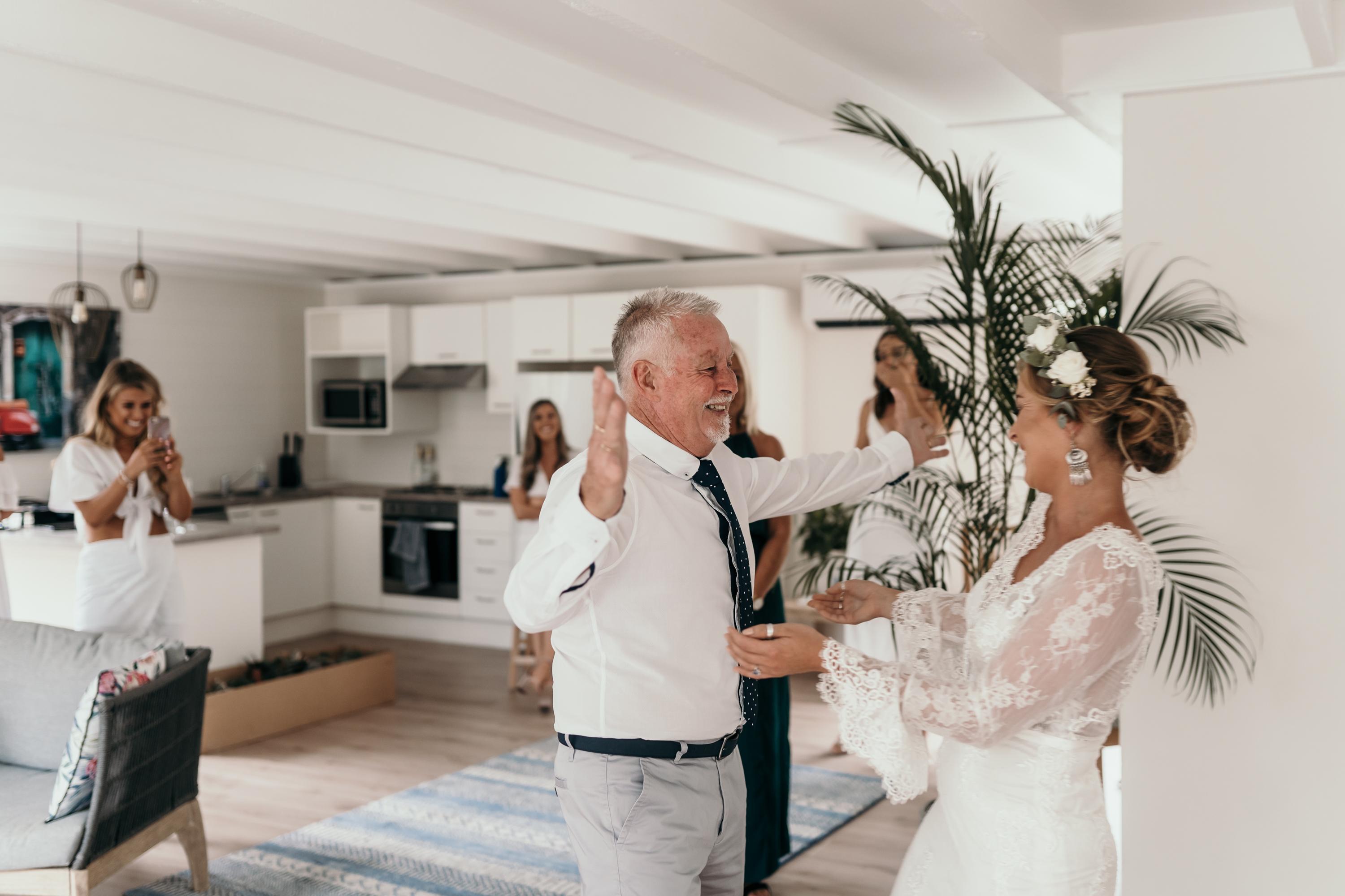 Dad seeing daughter for the first time at wedding